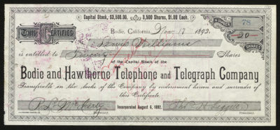 Certificate with blue and black ink shows intricate bordering, lettering, signatures, and “canceled” handwritten in red ink