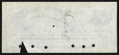 Backside shows one illegible signature and punched out star-shaped holes.