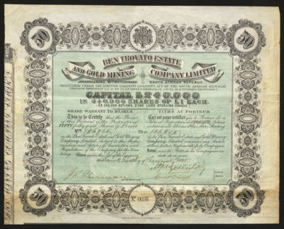 Certificate with black and green ink shows intricate borders and lettering, and a family seal