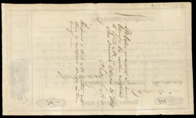 The back of this document has ink writing including signatures and legal language